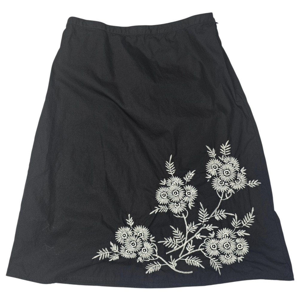 Classic Elements black A-line skirt featuring white floral embroidery